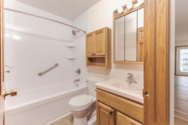 bathroom with toilet, vanity, and bathtub / shower combination