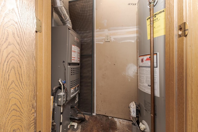 utility room featuring water heater