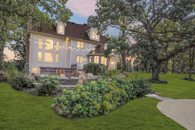 41W050 Stoneridge Ln, Elgin, IL 60124 - back of property at dusk featuring a lawn