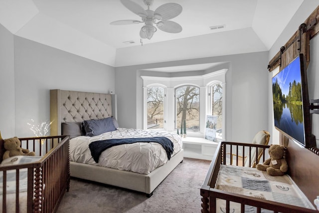 41W050 Stoneridge Ln, Elgin, IL 60124 - carpeted bedroom with visible vents, a barn door, and a ceiling fan