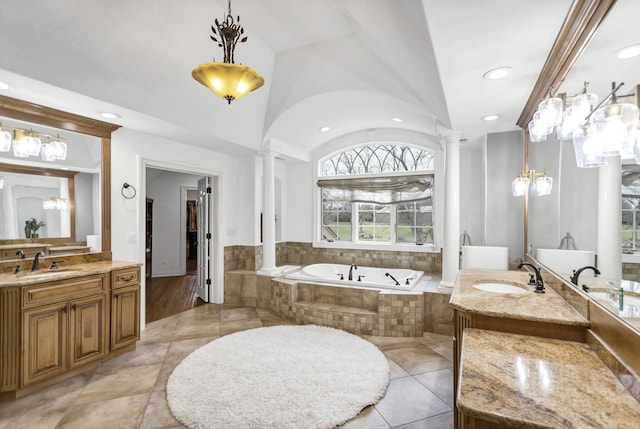 41W050 Stoneridge Ln, Elgin, IL 60124 - bathroom with a bath, decorative columns, two vanities, and a sink