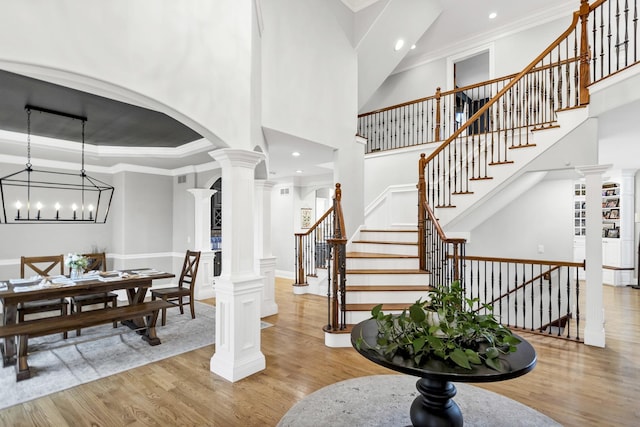 41W050 Stoneridge Ln, Elgin, IL 60124 - entryway featuring light wood-style flooring, recessed lighting, a towering ceiling, stairway, and ornate columns