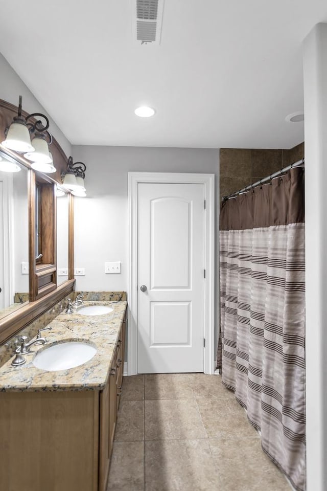 41W050 Stoneridge Ln, Elgin, IL 60124 - full bathroom featuring a sink, double vanity, a shower with shower curtain, and visible vents