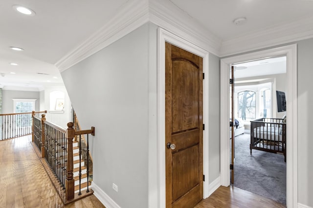 41W050 Stoneridge Ln, Elgin, IL 60124 - hallway with wood finished floors, an upstairs landing, recessed lighting, crown molding, and baseboards