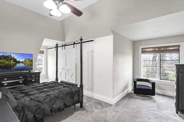 41W050 Stoneridge Ln, Elgin, IL 60124 - bedroom with a ceiling fan, a barn door, baseboards, carpet flooring, and vaulted ceiling