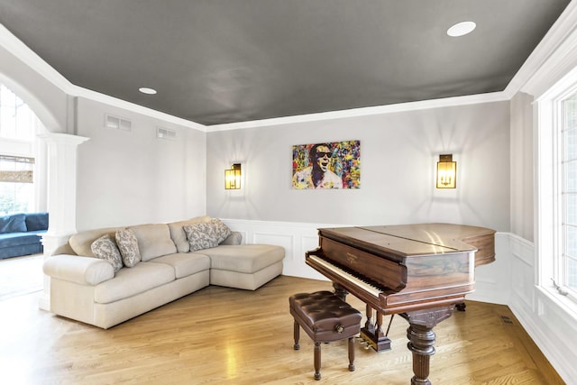41W050 Stoneridge Ln, Elgin, IL 60124 - living area featuring ornamental molding, a decorative wall, and a healthy amount of sunlight