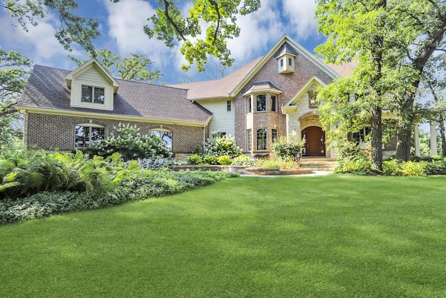 41W050 Stoneridge Ln, Elgin, IL 60124 - craftsman inspired home with stone siding, brick siding, and a front lawn
