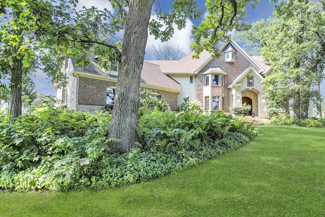 41W050 Stoneridge Ln, Elgin, IL 60124 - craftsman inspired home featuring stone siding, brick siding, and a front yard