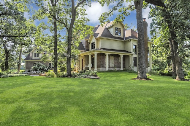 41W050 Stoneridge Ln, Elgin, IL 60124 - victorian home featuring a shingled roof, a chimney, and a front yard