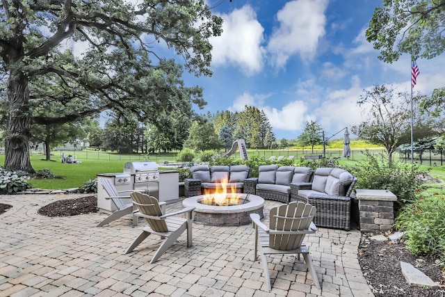 41W050 Stoneridge Ln, Elgin, IL 60124 - view of patio / terrace with an outdoor living space with a fire pit, fence, exterior kitchen, and grilling area