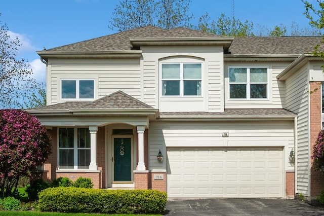 716 Samson Way, Northbrook, IL 60062 - view of front facade with asphalt driveway, an attached garage, roof with shingles, and brick siding