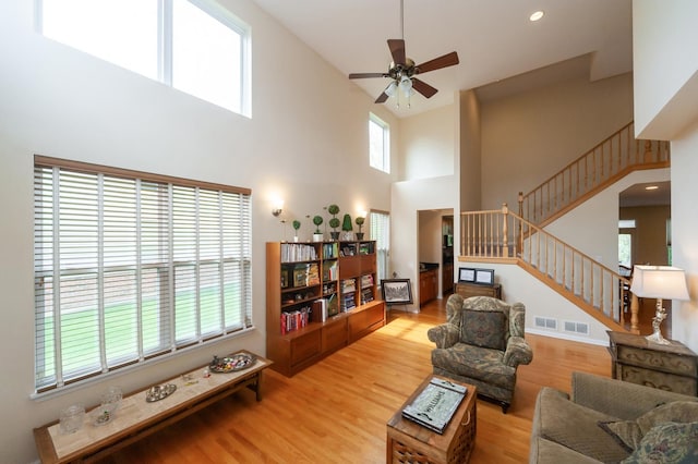 716 Samson Way, Northbrook, IL 60062 - living area featuring a high ceiling, stairs, ceiling fan, and wood finished floors