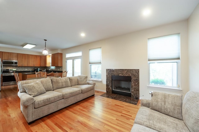 716 Samson Way, Northbrook, IL 60062 - living room featuring light wood-style floors, a high end fireplace, and recessed lighting