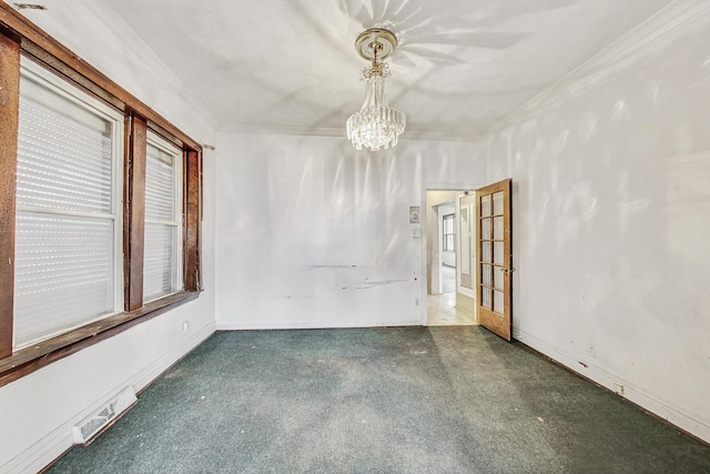 7658 S Laflin St, Chicago, IL 60620 - carpeted spare room featuring an inviting chandelier, visible vents, baseboards, and crown molding