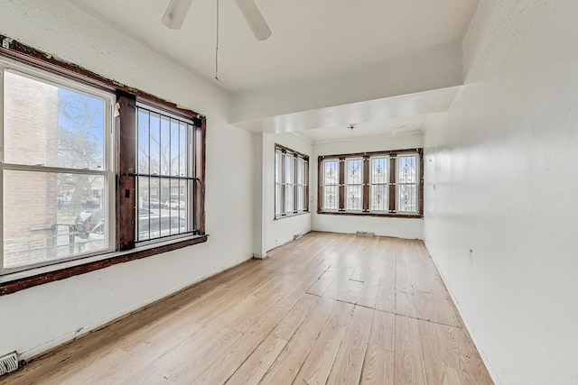 7658 S Laflin St, Chicago, IL 60620 - unfurnished room with light wood-style floors and a ceiling fan