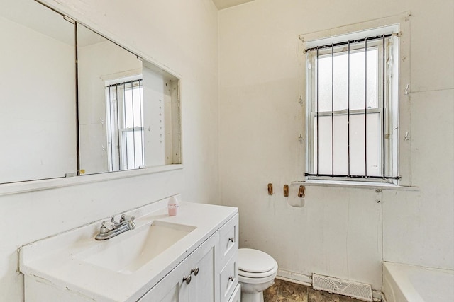 7658 S Laflin St, Chicago, IL 60620 - full bathroom with a bath, visible vents, toilet, and vanity