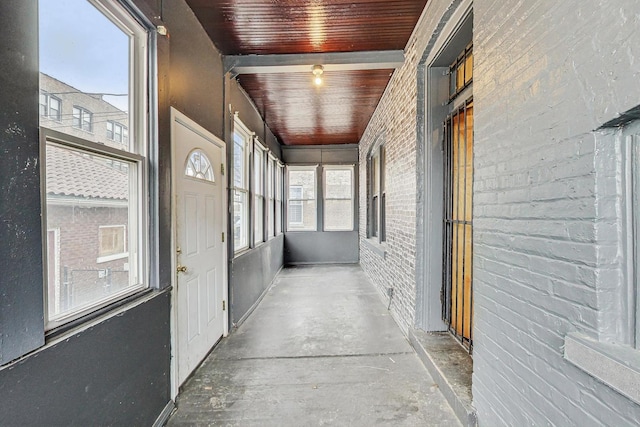 7658 S Laflin St, Chicago, IL 60620 - hall with wood ceiling, brick wall, and concrete floors