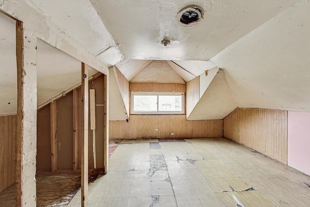 7658 S Laflin St, Chicago, IL 60620 - additional living space with wood walls, tile patterned floors, and lofted ceiling