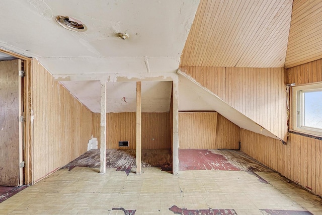 7658 S Laflin St, Chicago, IL 60620 - bonus room featuring tile patterned floors, wooden walls, and vaulted ceiling