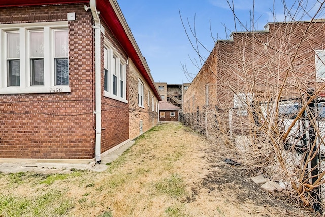 7658 S Laflin St, Chicago, IL 60620 - view of side of home featuring a yard and brick siding