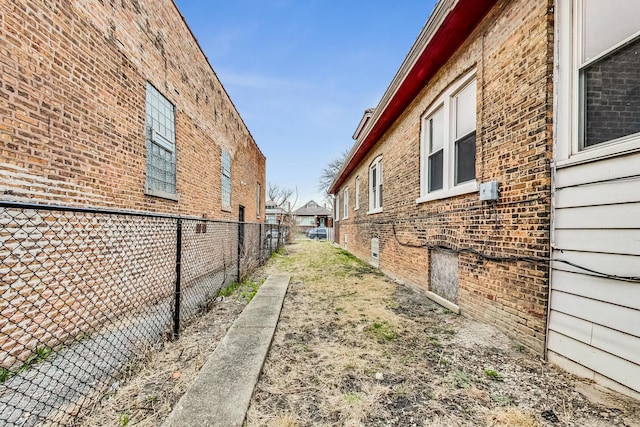 7658 S Laflin St, Chicago, IL 60620 - view of home's exterior with fence and brick siding
