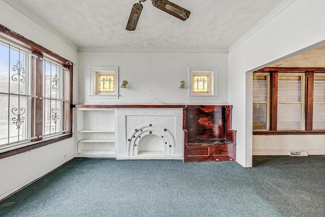 7658 S Laflin St, Chicago, IL 60620 - unfurnished living room featuring crown molding, baseboards, a textured ceiling, and carpet floors