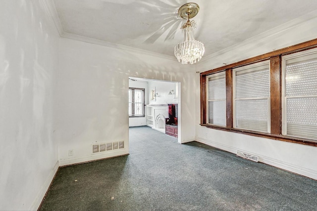 7658 S Laflin St, Chicago, IL 60620 - carpeted empty room with ornamental molding, visible vents, baseboards, and an inviting chandelier