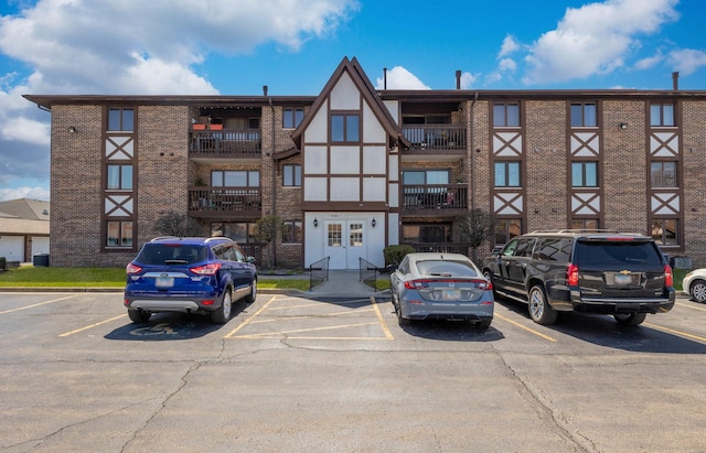 view of property featuring uncovered parking