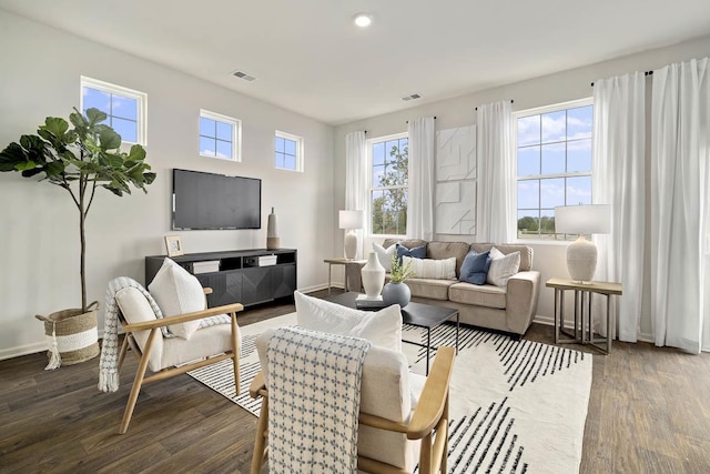6457 Juniper Dr, Wonder Lake, IL 60097 - living area featuring visible vents, baseboards, and wood finished floors