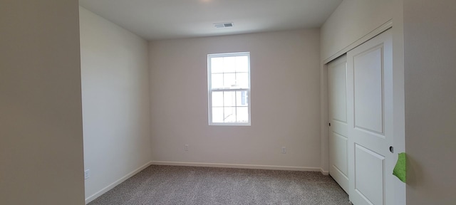 6457 Juniper Dr, Wonder Lake, IL 60097 - unfurnished bedroom featuring a closet, carpet, visible vents, and baseboards
