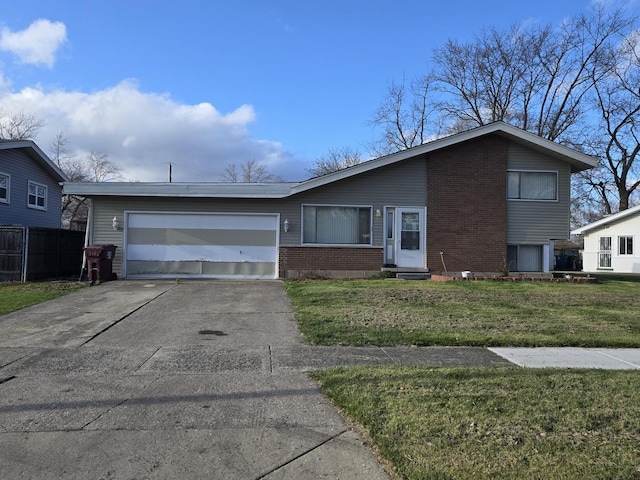 view of front of property featuring an attached garage, fence, brick siding, a front lawn, and driveway