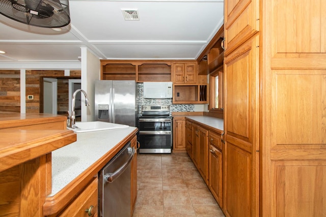 kitchen featuring open shelves, light countertops, visible vents, a sink, and appliances with stainless steel finishes