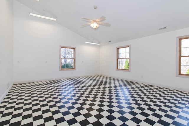 spare room featuring high vaulted ceiling, ceiling fan, baseboards, and visible vents