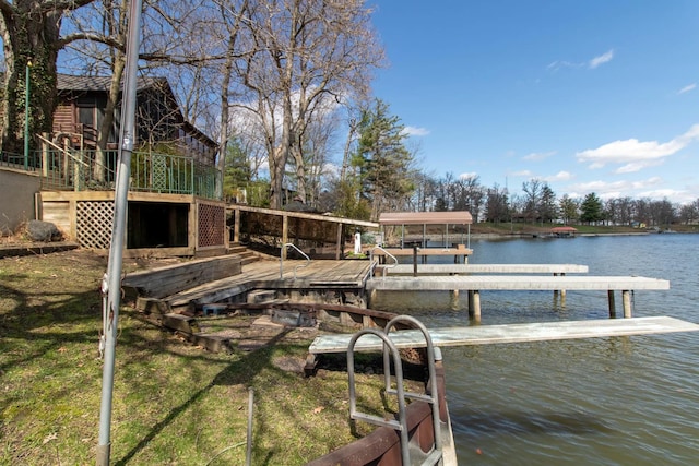 dock area with a water view and boat lift
