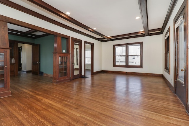 unfurnished room featuring french doors, baseboards, wood finished floors, and beamed ceiling