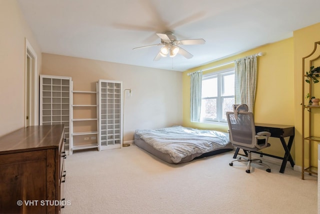 bedroom with carpet flooring, baseboards, and a ceiling fan