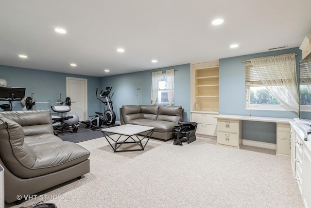 living room with light carpet, visible vents, and recessed lighting