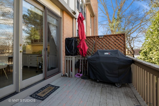 wooden deck with area for grilling