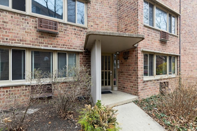 entrance to property with brick siding