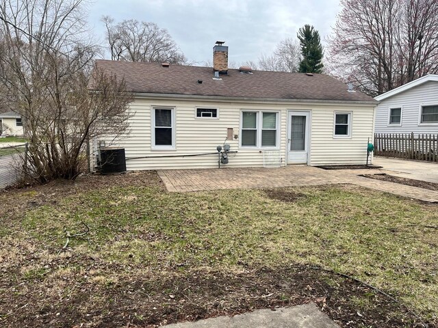 158 N Pershing Ave, Mundelein, IL 60060 - back of property with a patio, a chimney, and roof with shingles