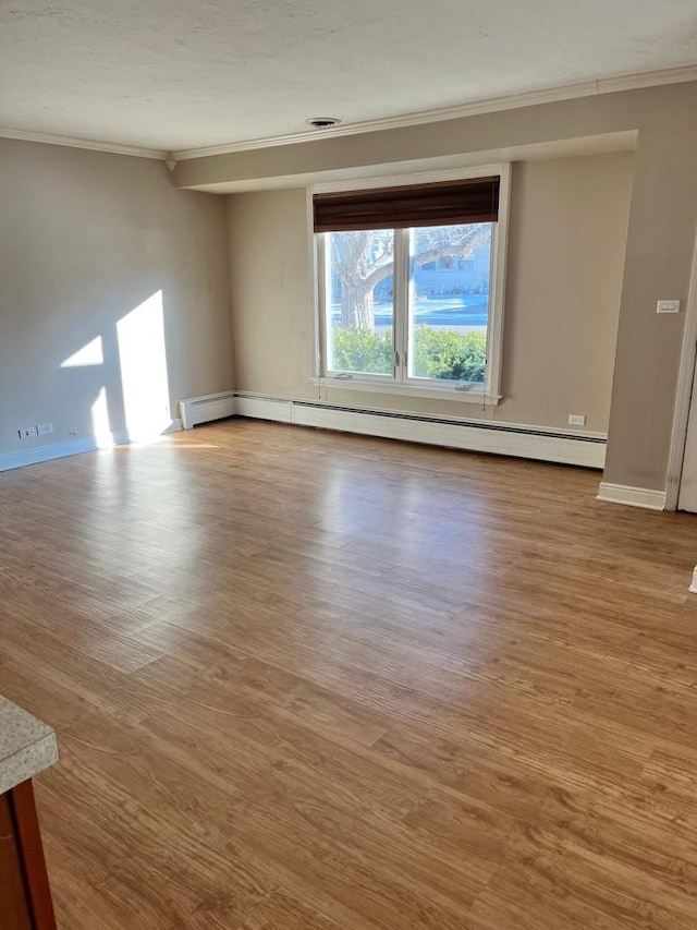 158 N Pershing Ave, Mundelein, IL 60060 - spare room featuring ornamental molding, wood finished floors, and a baseboard heating unit