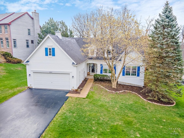 803 Pleasant Dr, Fox River Grove, IL 60021 - traditional-style house featuring a chimney, aphalt driveway, and a front lawn