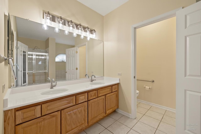 803 Pleasant Dr, Fox River Grove, IL 60021 - full bathroom with tile patterned floors, toilet, a shower stall, and a sink
