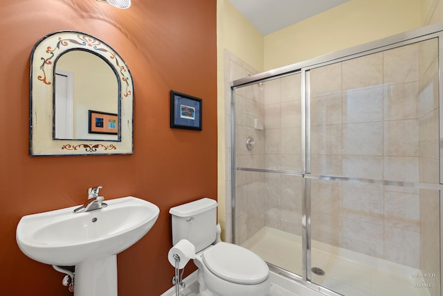 803 Pleasant Dr, Fox River Grove, IL 60021 - bathroom featuring toilet, a stall shower, and a sink
