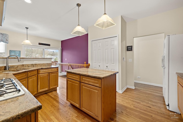 803 Pleasant Dr, Fox River Grove, IL 60021 - kitchen with white appliances, light stone counters, light wood-style flooring, and a sink