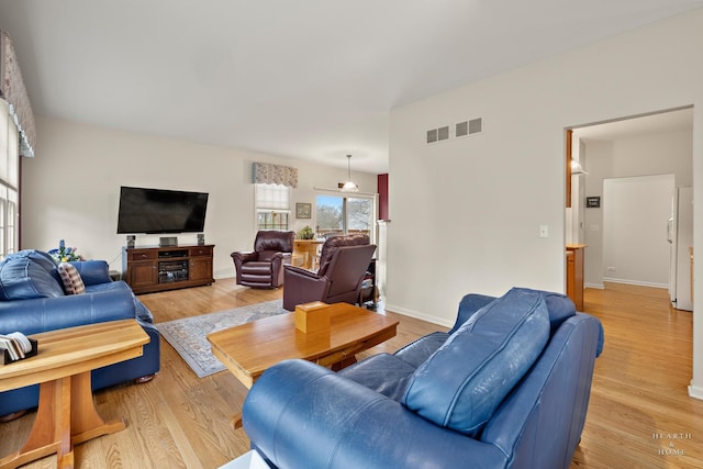 803 Pleasant Dr, Fox River Grove, IL 60021 - living room featuring baseboards, visible vents, and light wood-style floors