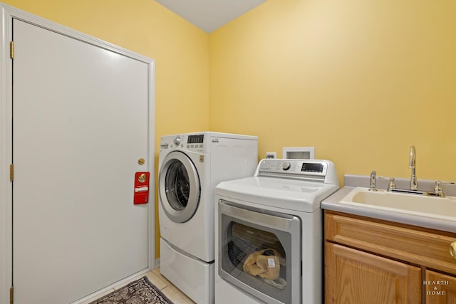 803 Pleasant Dr, Fox River Grove, IL 60021 - laundry room with light tile patterned floors, washer and dryer, cabinet space, and a sink