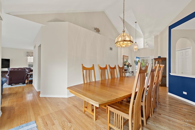 803 Pleasant Dr, Fox River Grove, IL 60021 - dining area featuring an inviting chandelier, light wood-style flooring, baseboards, visible vents, and high vaulted ceiling
