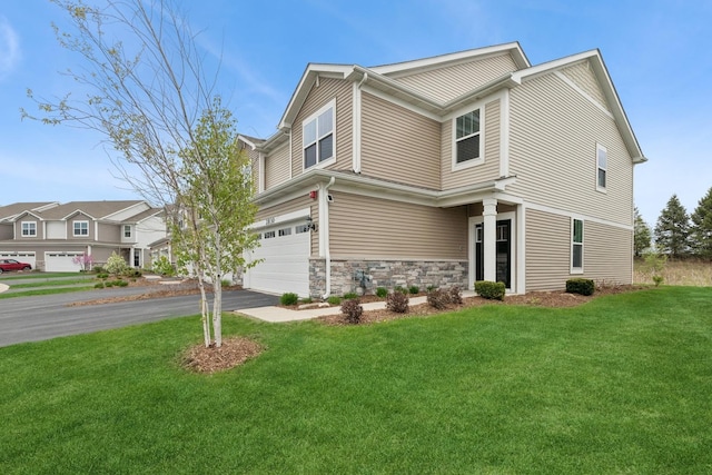 2830 Kessler Dr, Mundelein, IL 60060 - view of front of property with a garage, driveway, a front yard, and stone siding