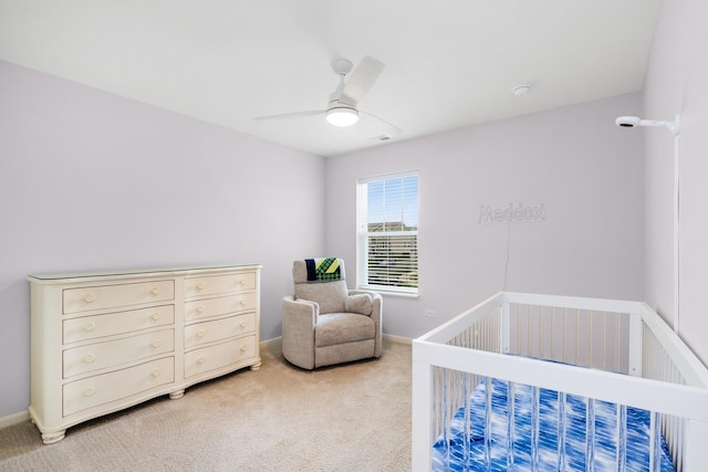 2830 Kessler Dr, Mundelein, IL 60060 - bedroom featuring light colored carpet, a crib, ceiling fan, and baseboards
